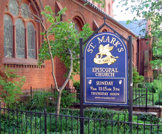 photograph of the sign for St. Mark's Episcopal Church with the side of the church in the background