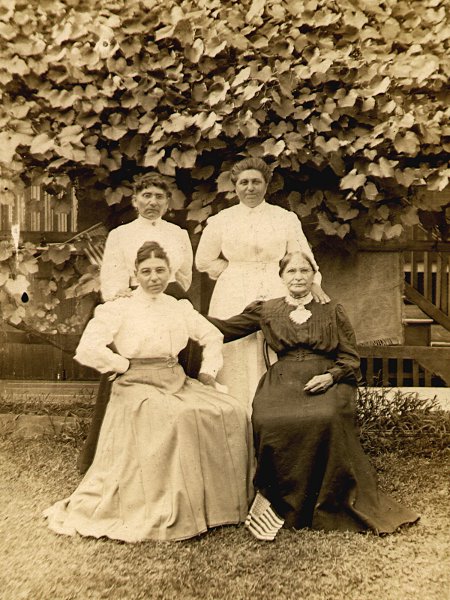 photographic portrait of four Etling women posing outside