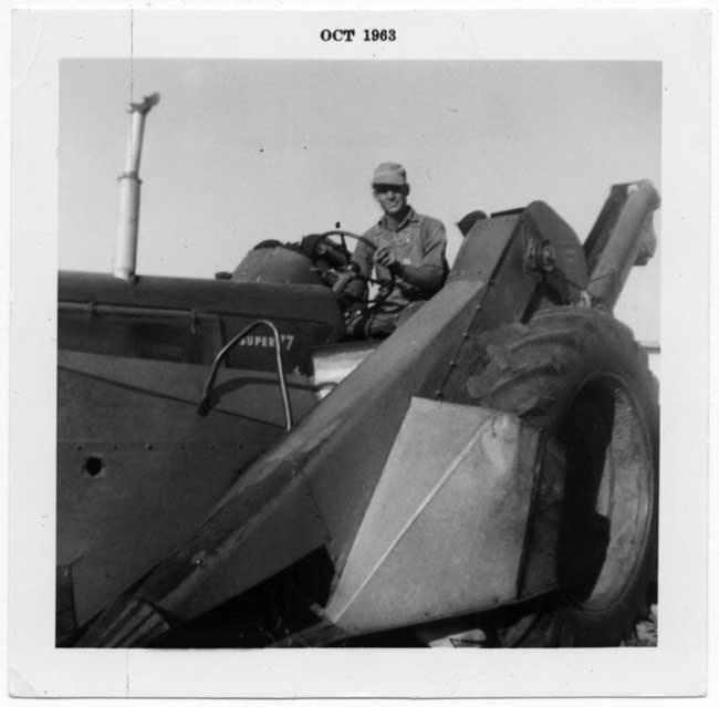 photograph of Henry Martin Fiegenbaum behind the wheel of a tractor
