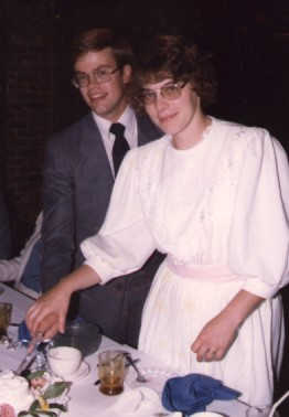photograph of Eric N. Fieganbaum and Linda S. Heath cutting their wedding cake