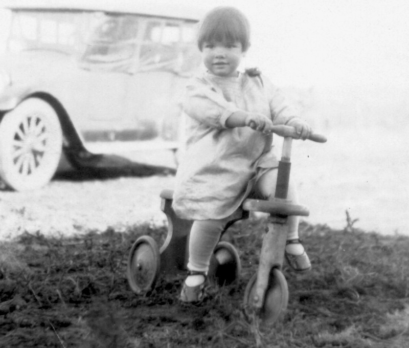 photograph of a very young Dorothy Lorraine Fiegenbaum on her scooter