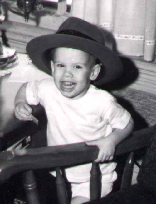photo of a young Eric N. Fiegenbaum wearing his father's hat at Elmhurst, Illinois, about 1961