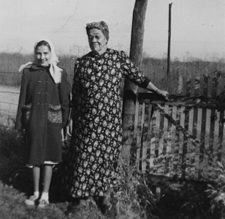 photograph of Mary Henrietta Fiegenbaum and her grandmother, Henriette C. A. Fiegenbaum standing in the front yard