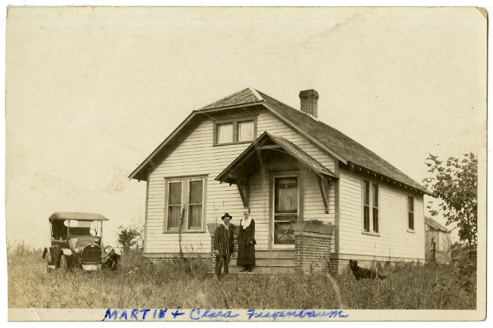 photograph of Martin & Clara Fiegenbaum standing outside their home south of Mayview, Missouri