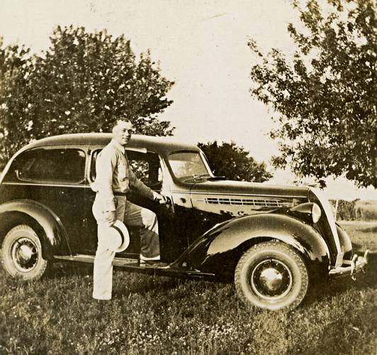 photograph of Martin with his car