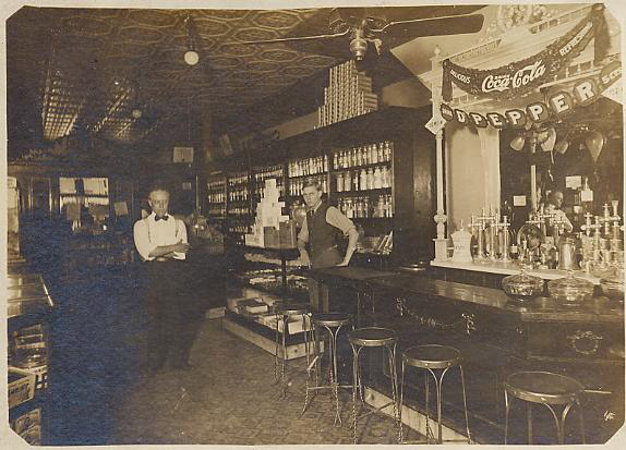 photo of Rudolph M. Gerber and an unidentified clerk in his drug store at St. Louis, Missouri, about 1909 to 1915