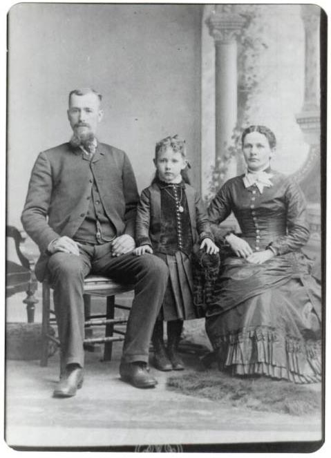 photographic studio portrait of Frank I. and Lydia M. (Fiegenbaum) Howard family