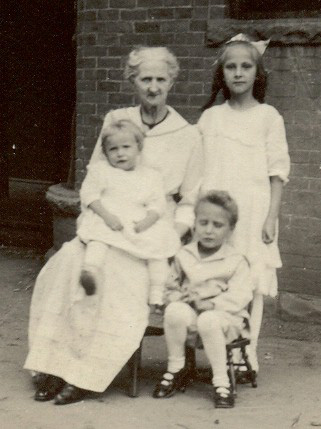 photo of Caroline K. Steinmetz outside with three of her grandchildren
